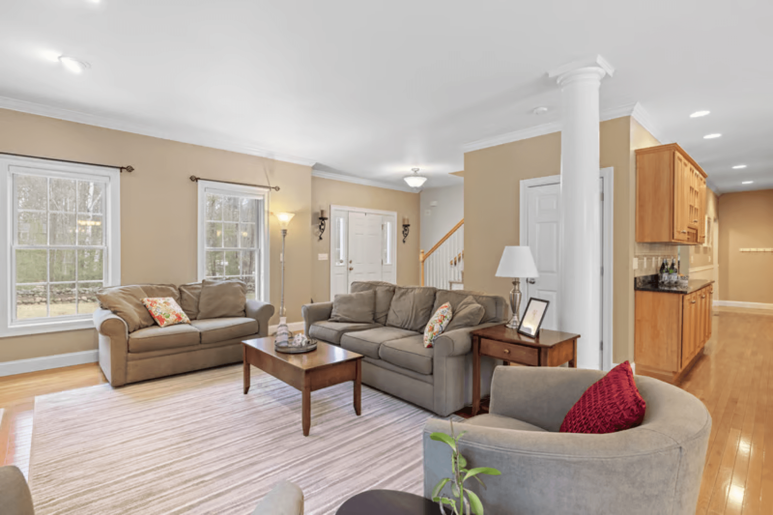 Bright living room in a large Boca Raton style home after a cleaning
