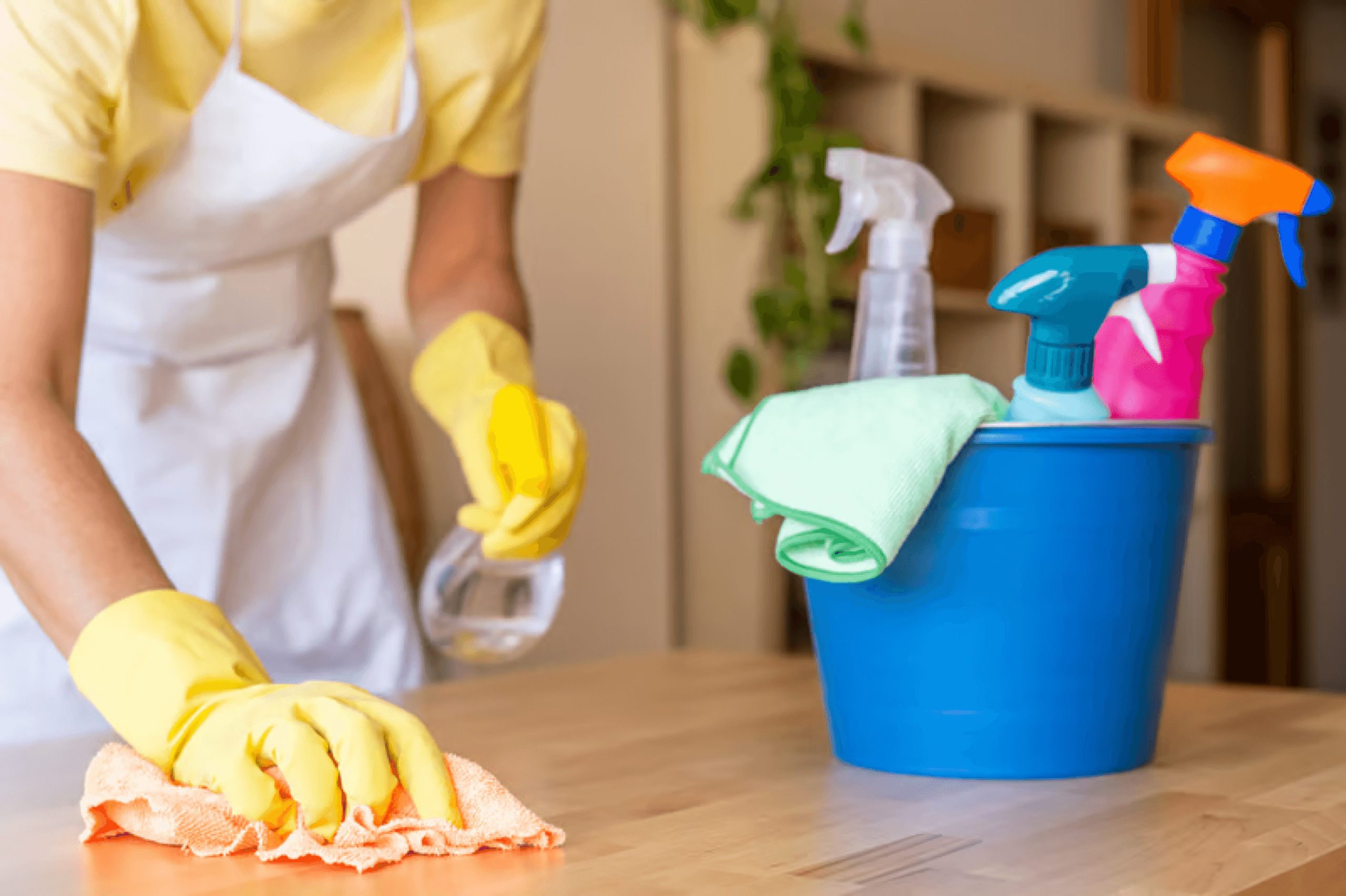 Cleaning supplies and apron laid out before a job